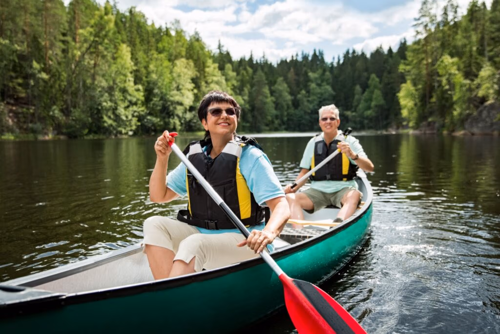 A couple in their 50s canoeing.