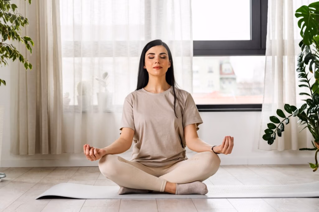 A woman meditating.