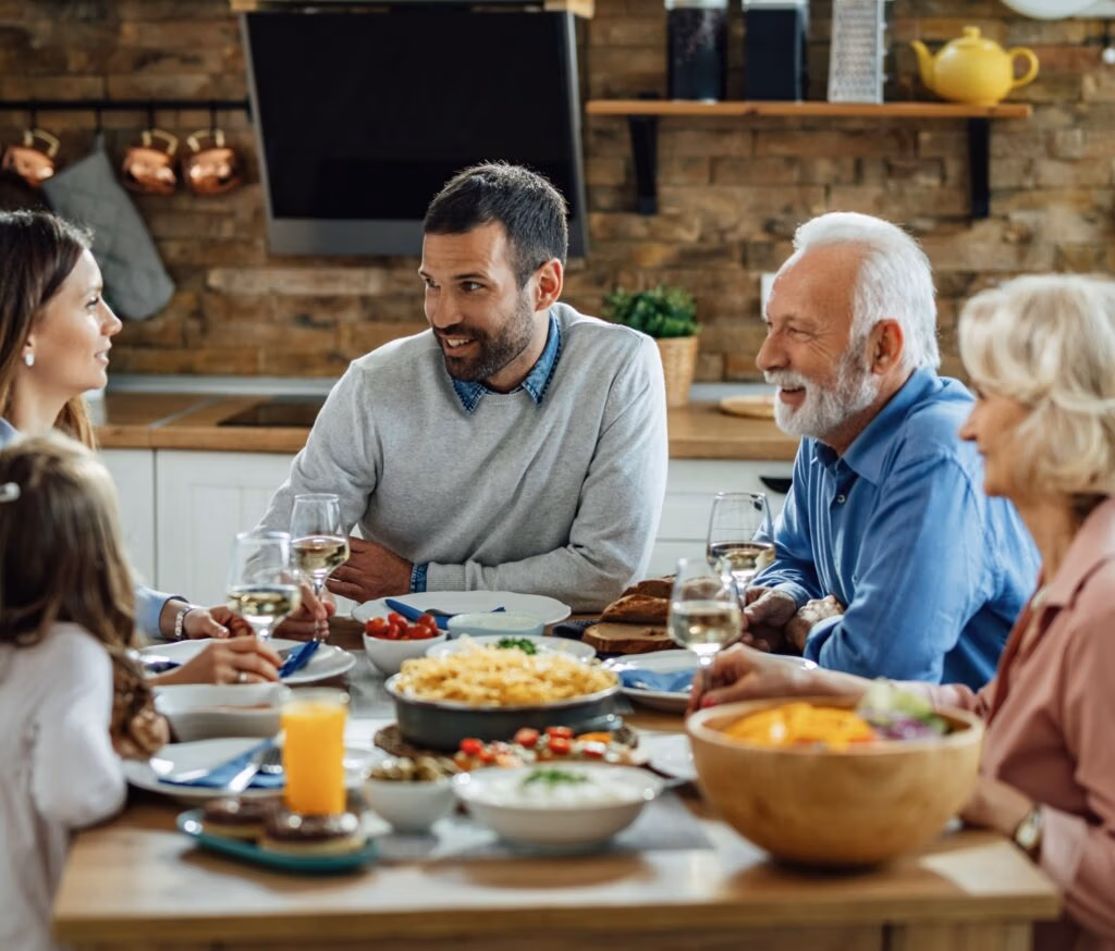 Multiple generations enjoying a family dinner.