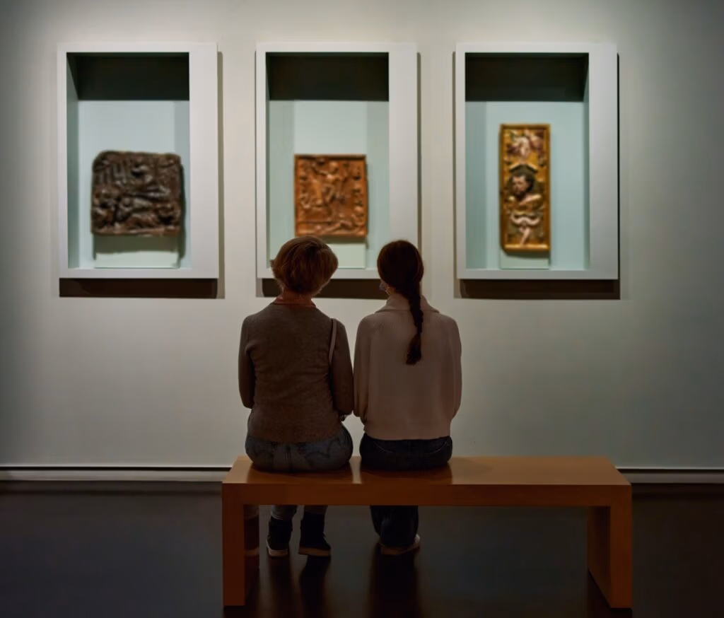 Two people looking at art in a gallery.