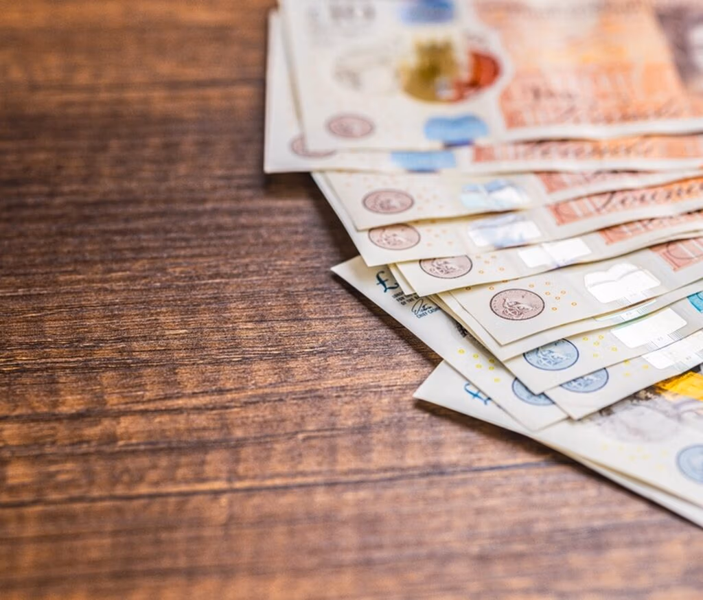 UK bank notes on a table.